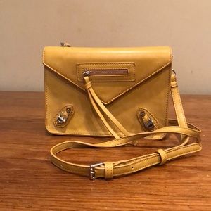 Stylish  mustard cross-body handbag.